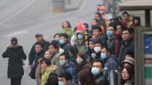 China's worsening air pollution has exacted a significant economic toll, grounding flights, closing highways and keeping tourists at home. Photograph from STR/AFP/Getty Images