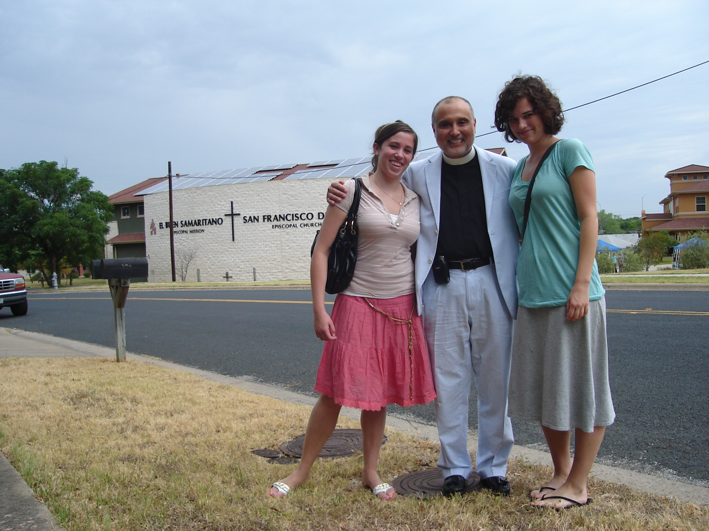 Adrien and I with Reverend Jose Palma--if you look closely you can see the solar panels forming a cross on the roof of the church building behind us