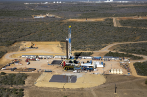 Oil drilling site, with pond for fracking water, Cotulla, TX  Photo by Al Braden